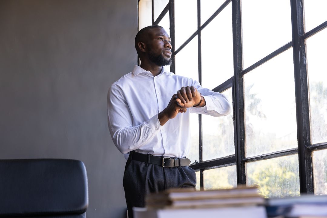 Professional Executive Checking Time in Minimalist Office Setting