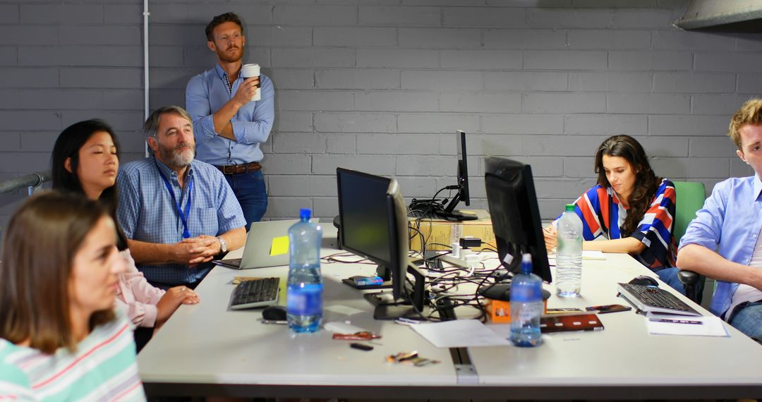 Diverse Team in Modern Office Collaborating on Project