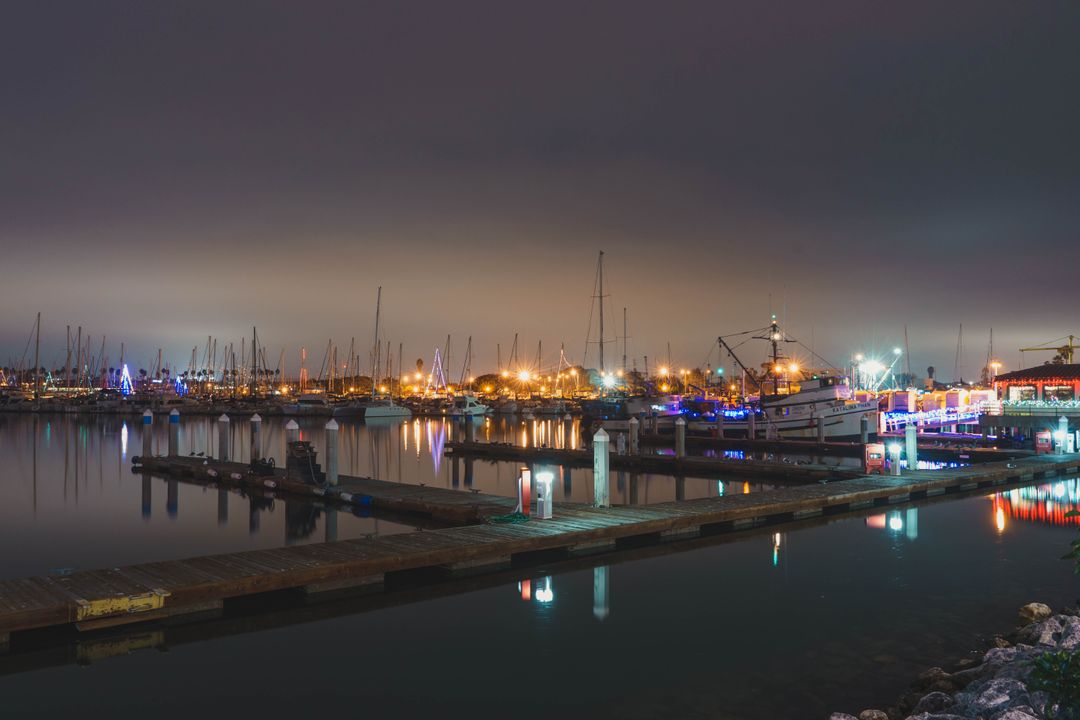 Scenic Night View of Marina with Boats and Colorful Lights - Free Images, Stock Photos and Pictures on Pikwizard.com