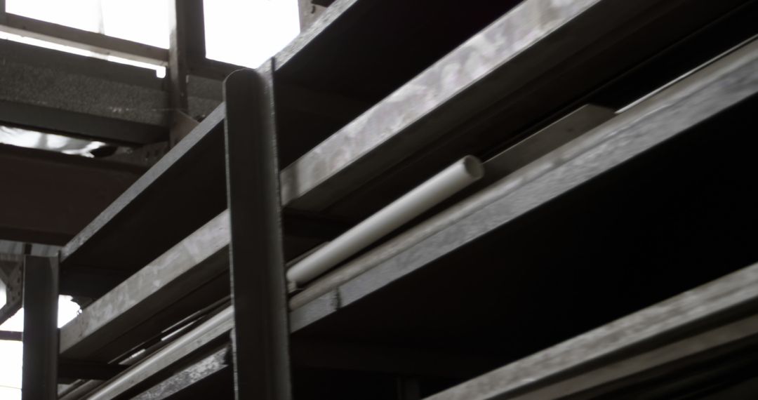 A close-up view of metal beams and pipes, part of a building's structure or an industrial setting - Free Images, Stock Photos and Pictures on Pikwizard.com