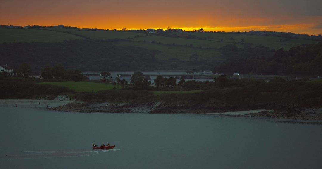 Fishermen on Boat at Dusk with Scenic Landscape - Free Images, Stock Photos and Pictures on Pikwizard.com