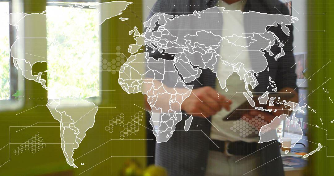 Businessman Using Tablet with Digital World Map Overlay in Office