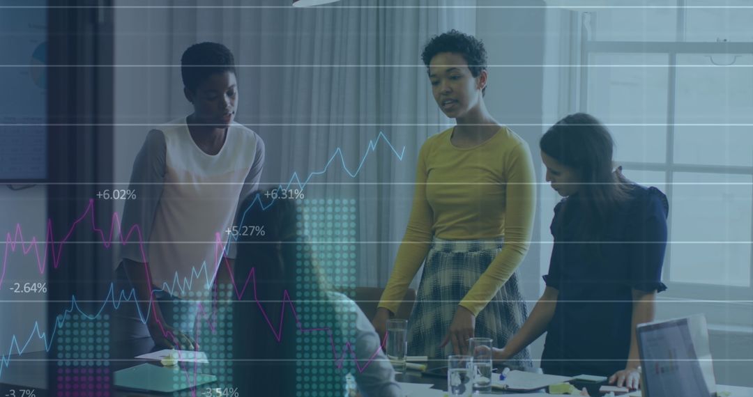 Diverse Women Collaborating in Modern Office with Data Overlay