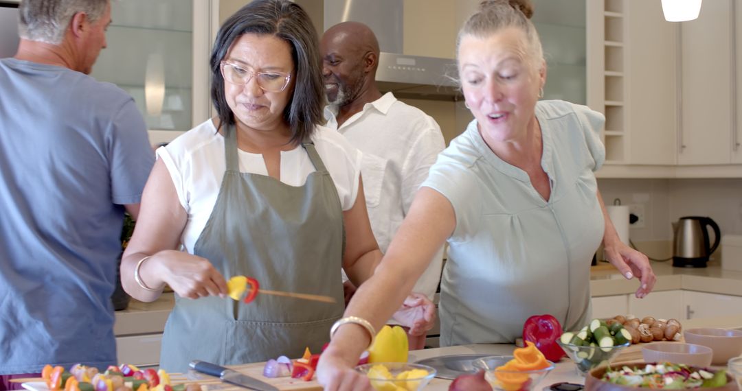 Diverse Group Enjoying Meal Prep in Modern Kitchen Setting
