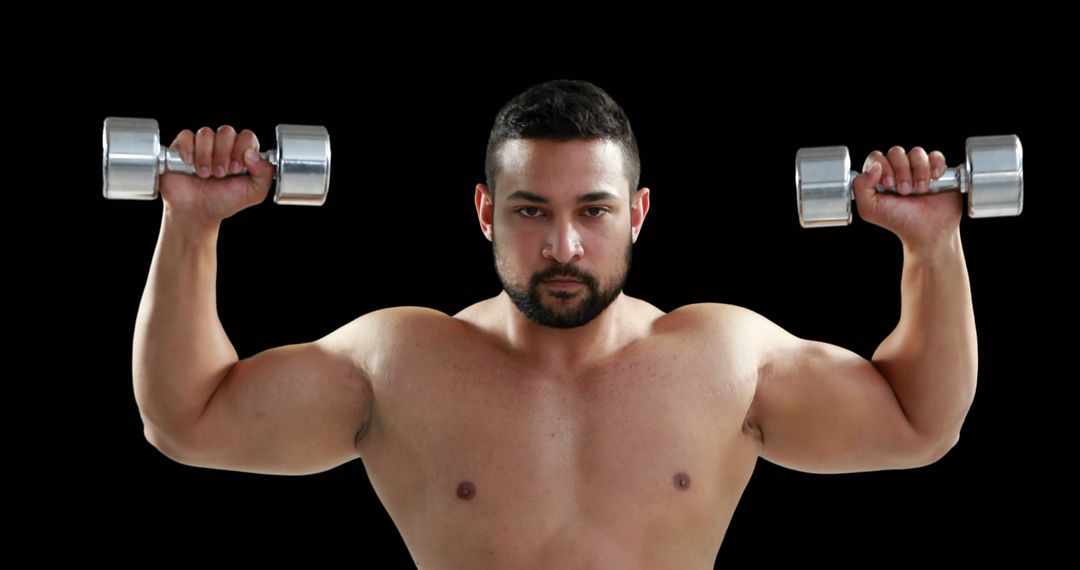 Muscular Man Exercising with Dumbbells on Black Background - Free Images, Stock Photos and Pictures on Pikwizard.com