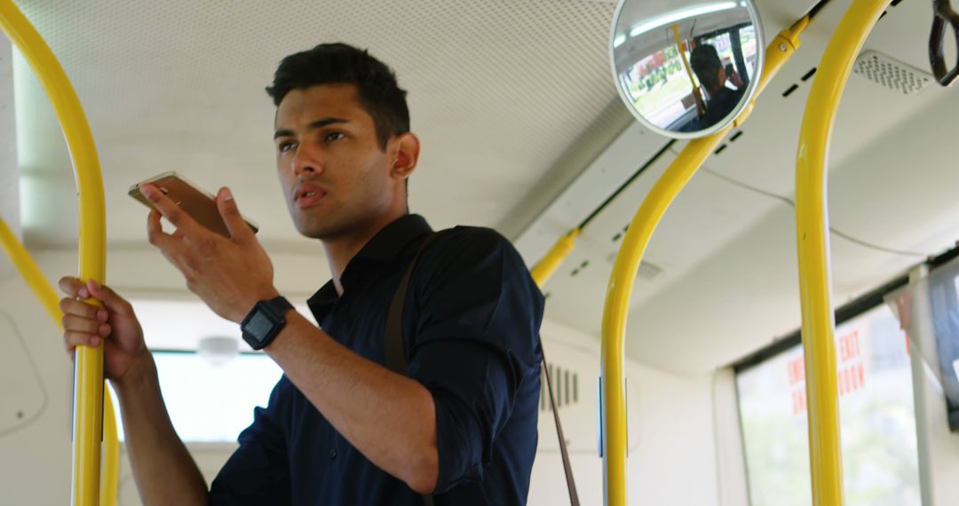 Young Man Using Smartphone in Public Transport Bus - Free Images, Stock Photos and Pictures on Pikwizard.com