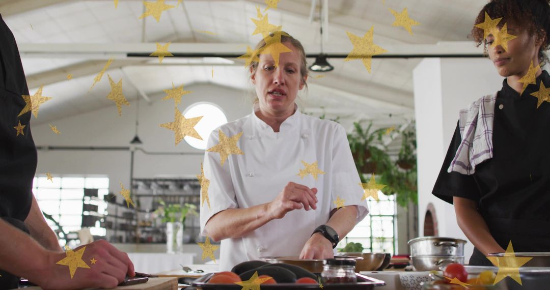 Head chef teaching hands-on culinary techniques and knife skills to kitchen team