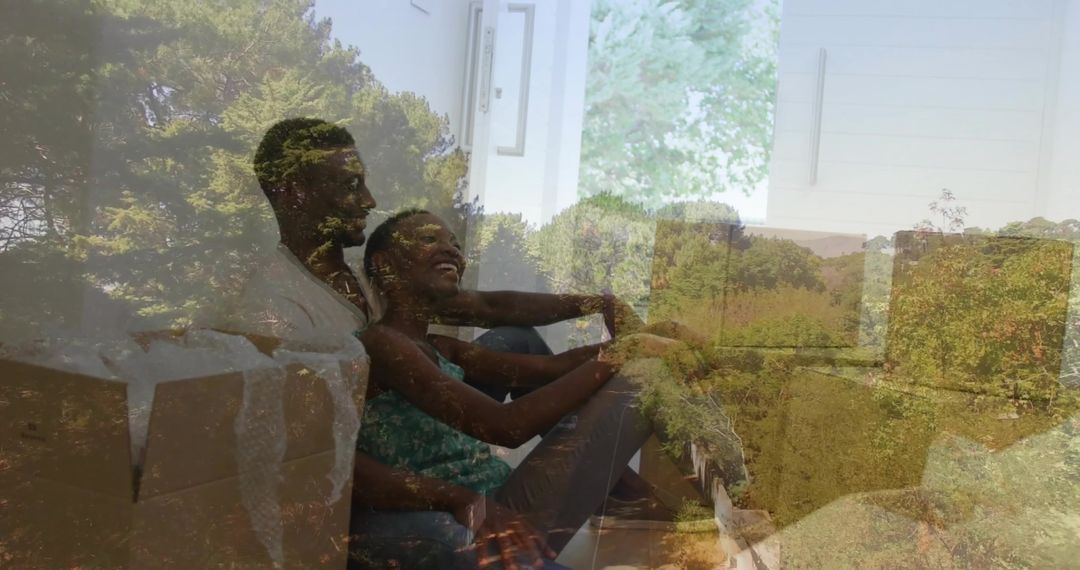 Joyful Couple Relaxing on Floor with Moving Boxes in New Home