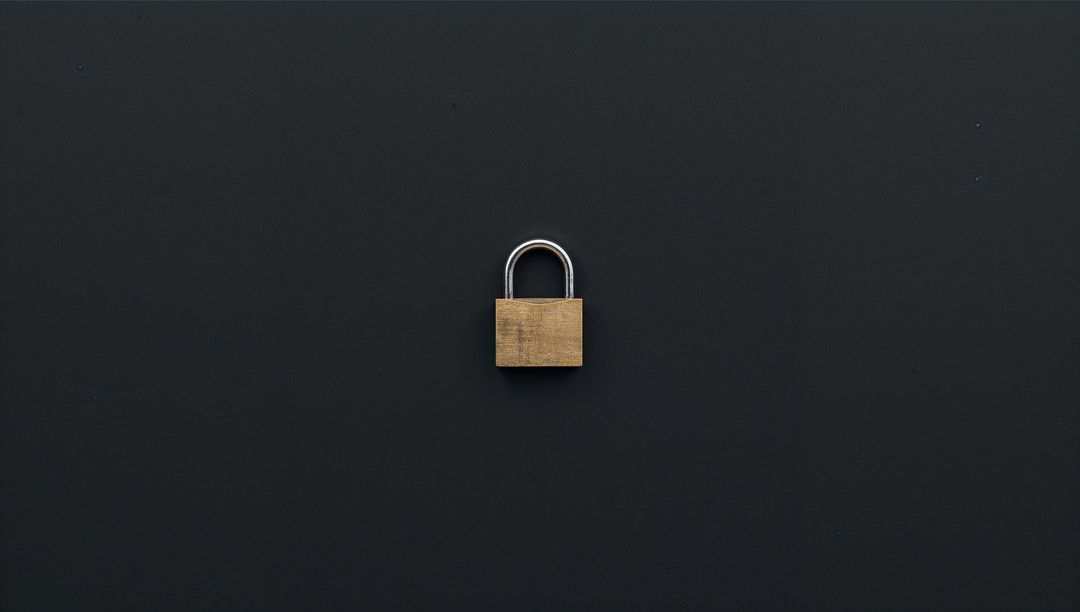 Brass Padlock Sitting on Dark Matte Surface Minimal Security Concept with Silver Shackle