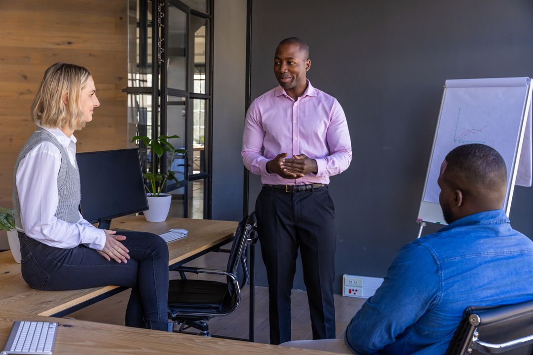 Multiracial Team Discussing Business Strategy in Modern Office
