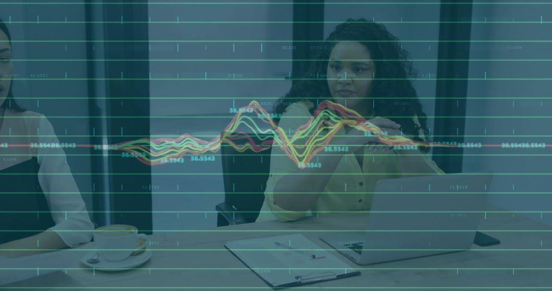 Businesswoman Gesturing Over Virtual Data Visualization During Team Analytics Meeting