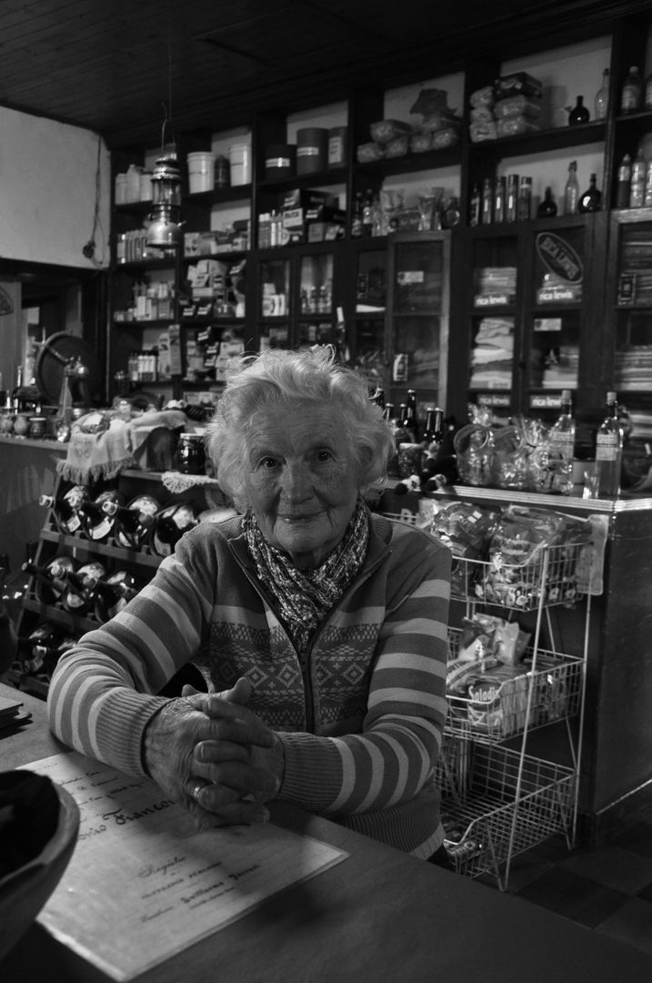 Elderly Woman in Traditional Grocery Store Black and White - Free Images, Stock Photos and Pictures on Pikwizard.com