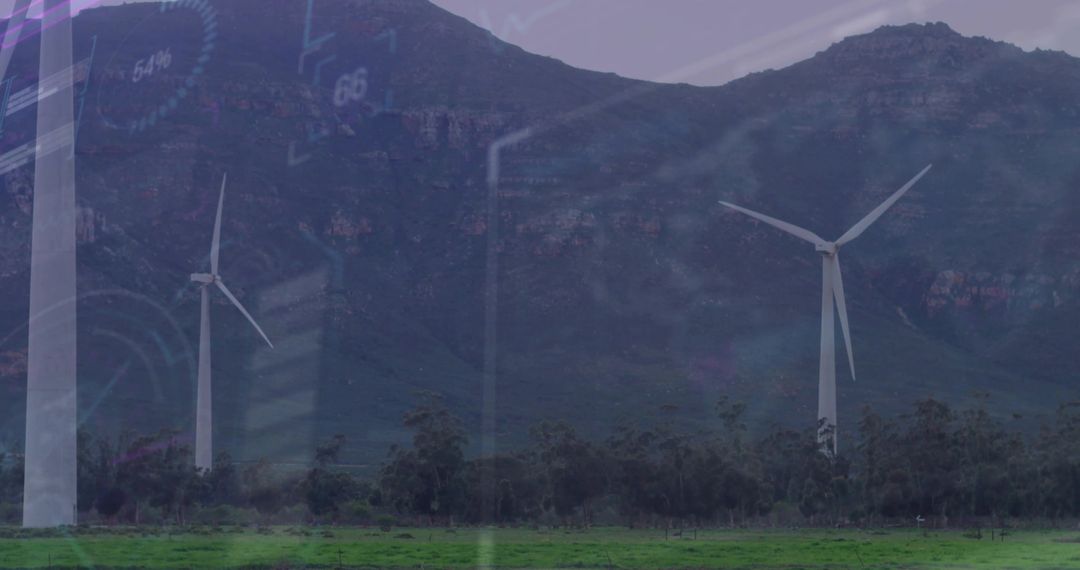Wind turbines generating clean energy at mountain base with subtle digital HUD overlay