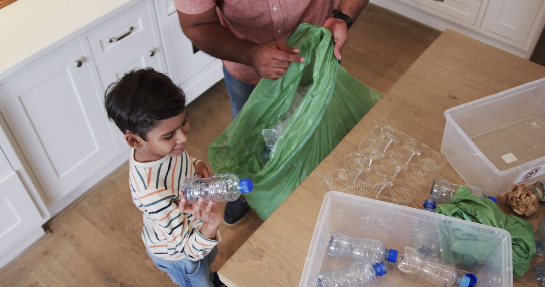 Father and Son Recycling Plastic Bottles at Home - Free Images, Stock Photos and Pictures on Pikwizard.com