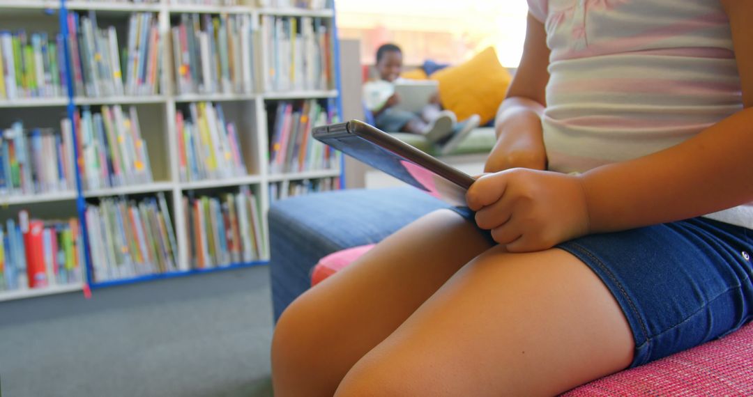 Girl Using Tablet in Colorful School Library, Encouraging Learning