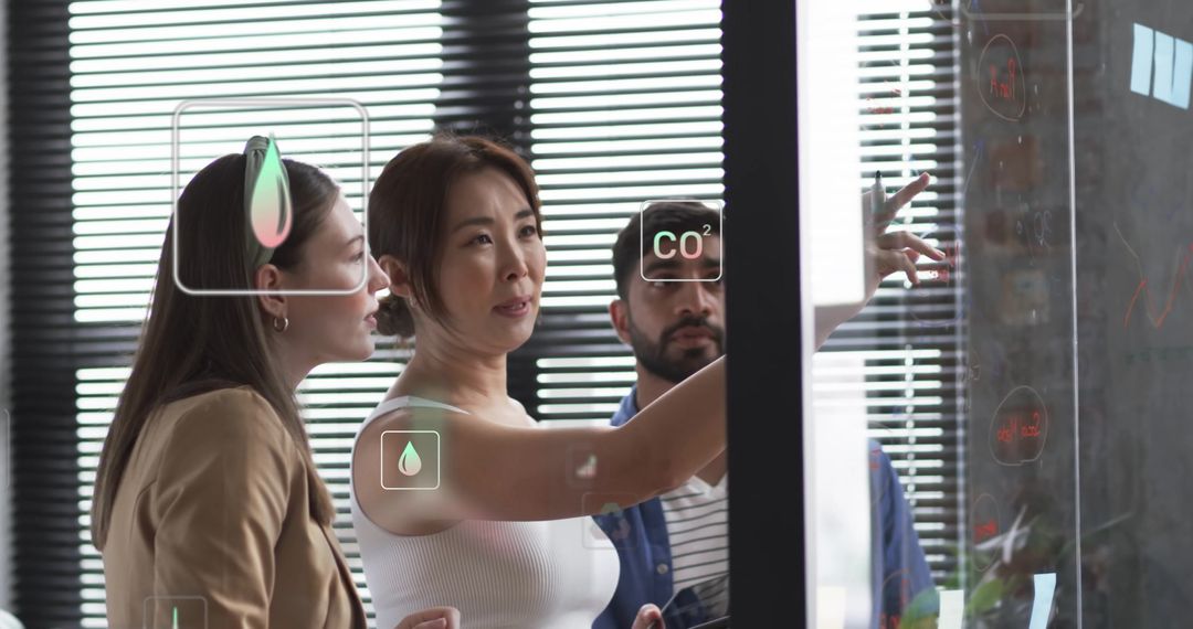 Diverse Team Collaborating with Digital Interface in Eco-Friendly Office