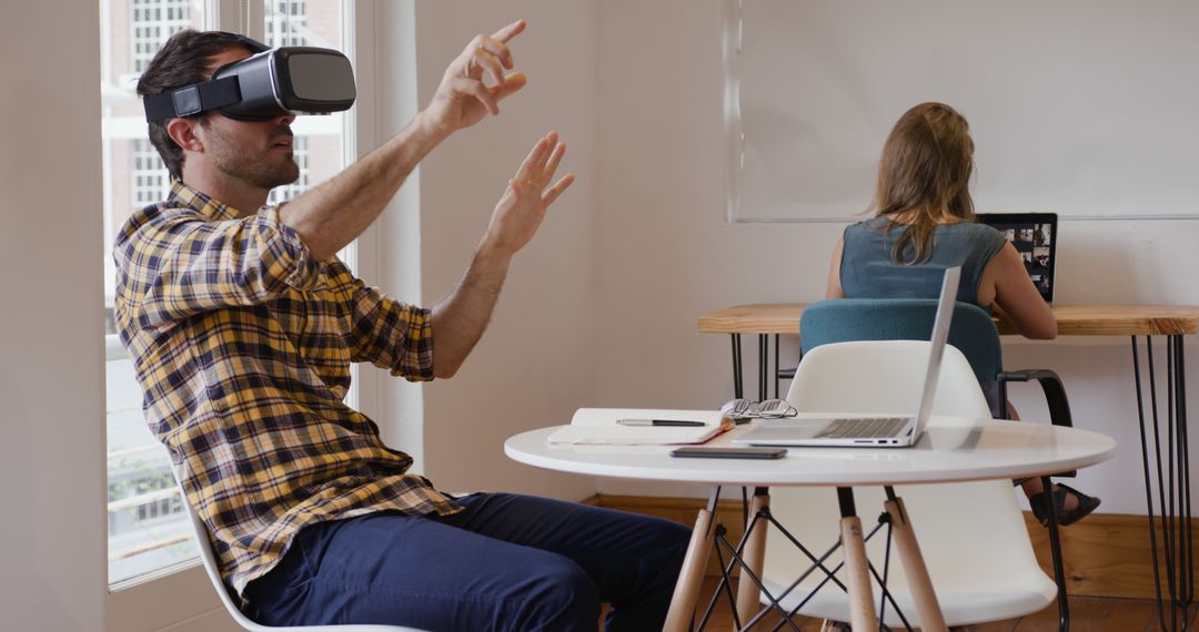 Man Using VR Headset in Modern Office - Free Images, Stock Photos and Pictures on Pikwizard.com