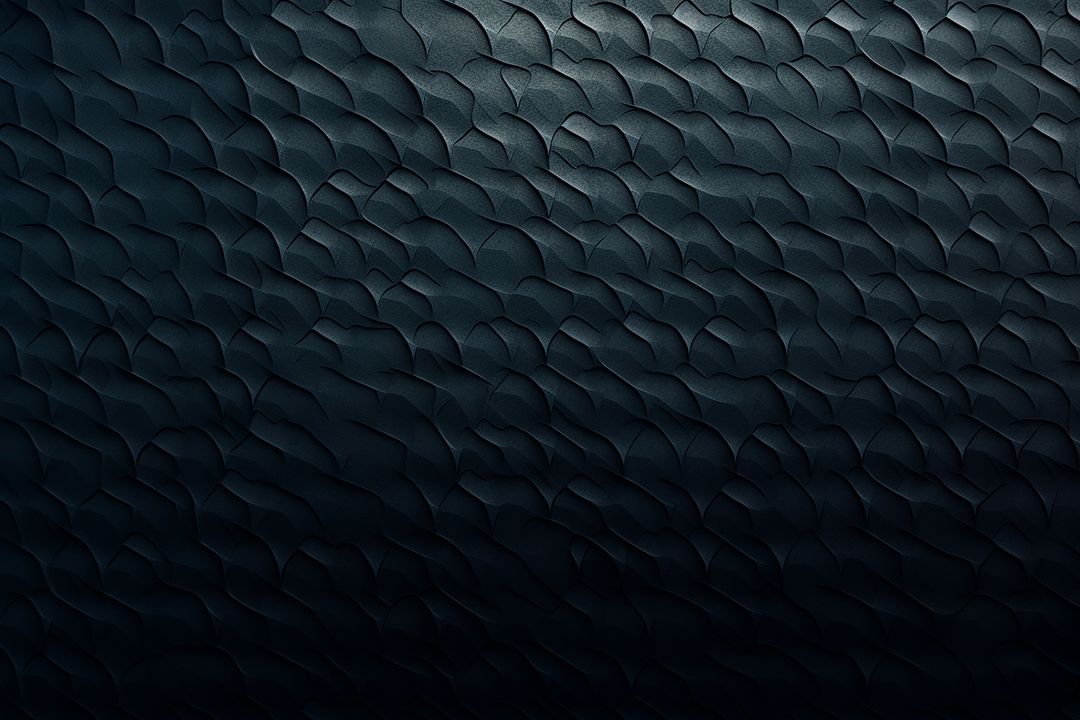 Dark textured surface with abstract design pattern