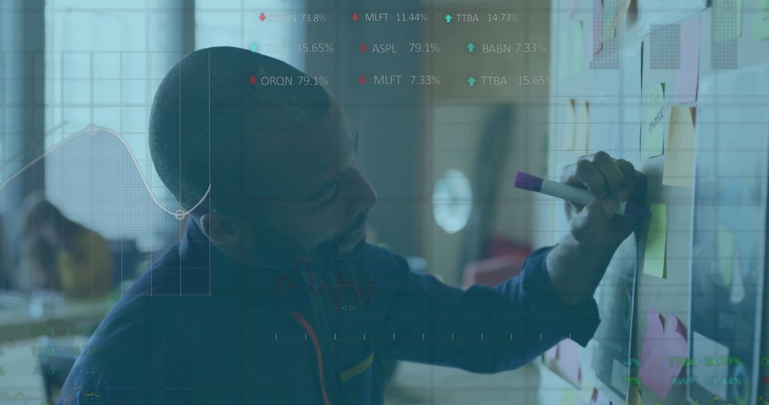 Team Lead Arranging Sticky Notes in Modern Open Office