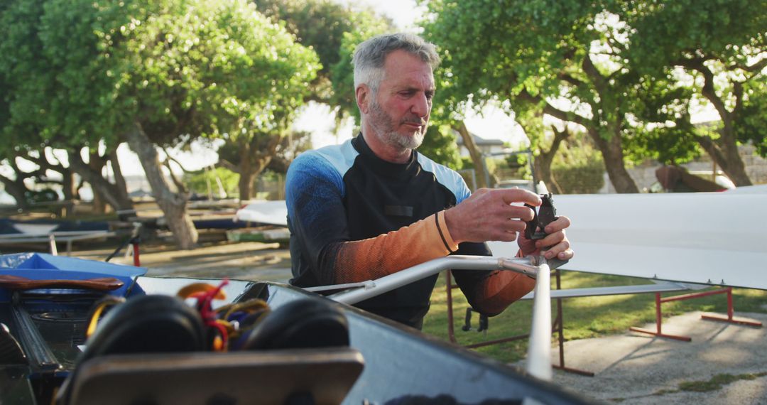 Senior Man Preparing Sailing Boat Outdoors - Free Images, Stock Photos and Pictures on Pikwizard.com