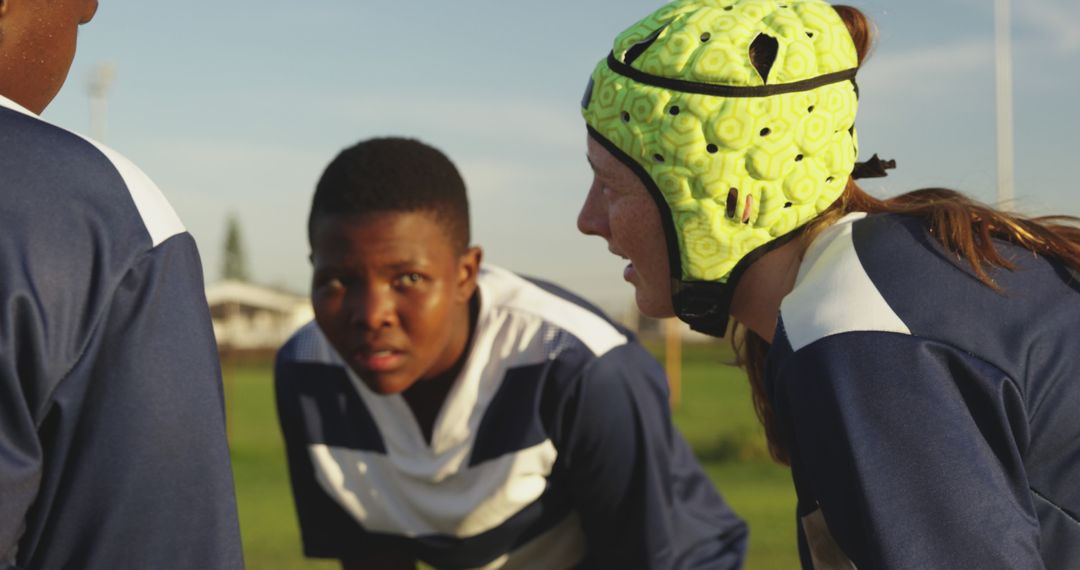 Teenage Rugby Team Members Strategizing on Field - Free Images, Stock Photos and Pictures on Pikwizard.com