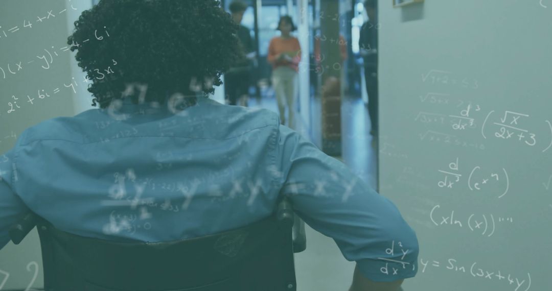 Disabled Man in Wheelchair Exploring Futuristic Work Environment