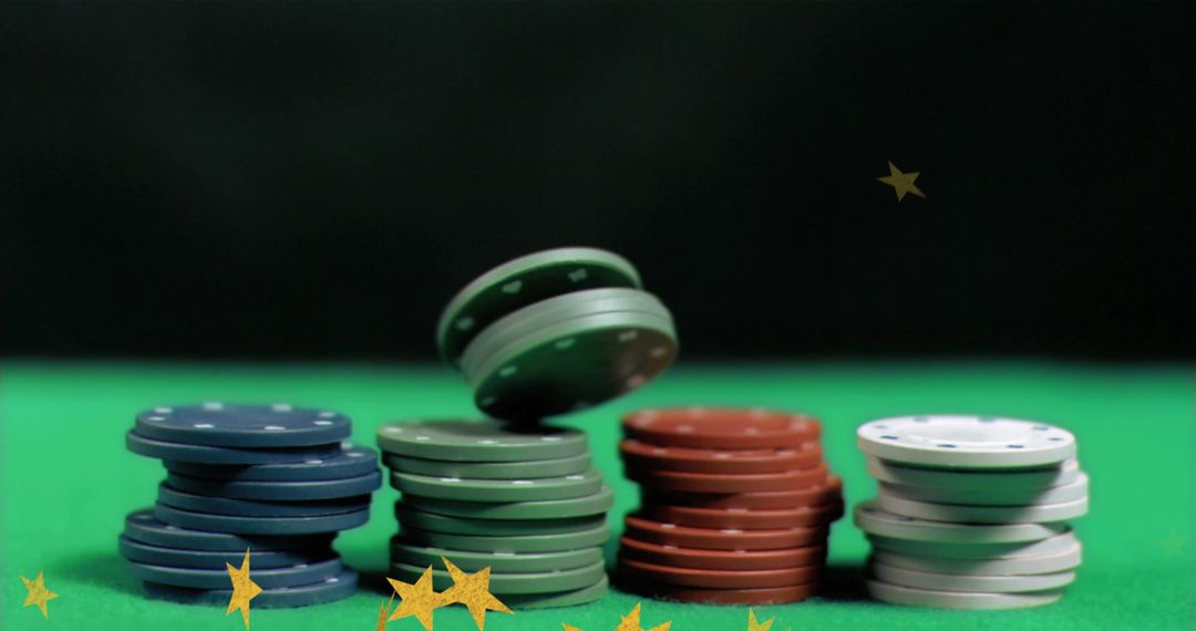 Stacked Poker Chips with Falling Stars on Green Table