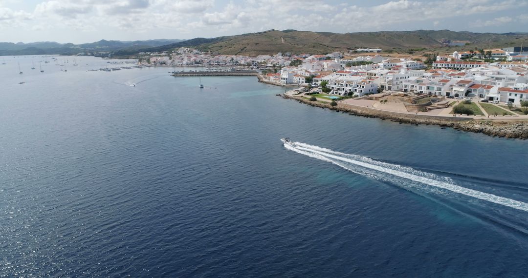 Aerial view of Menorca coastline with boat on Mediterranean Sea - Free Images, Stock Photos and Pictures on Pikwizard.com