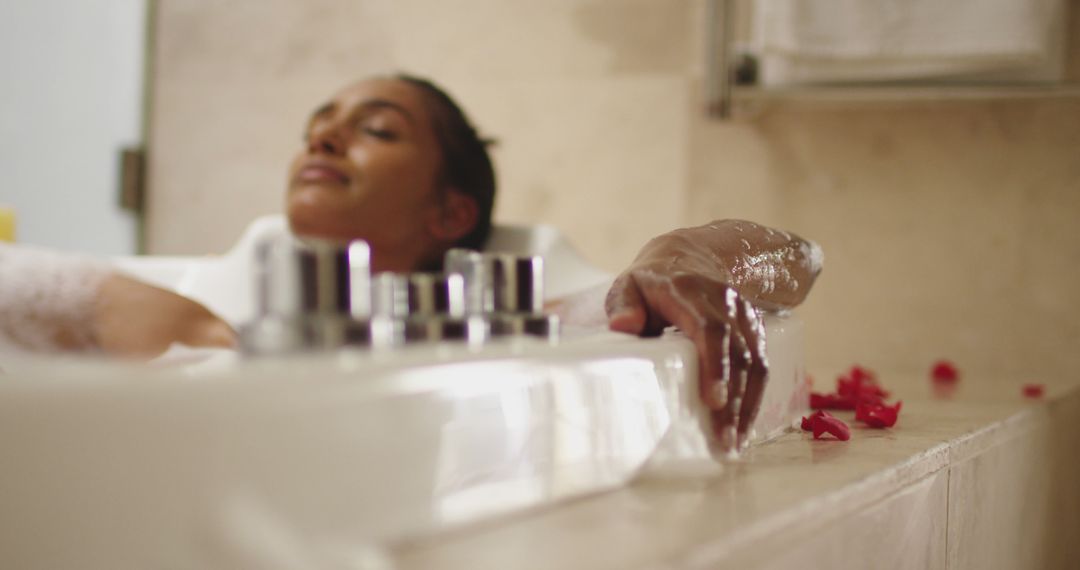 Woman Relaxing in Spa Bathtub with Rose Petals - Free Images, Stock Photos and Pictures on Pikwizard.com