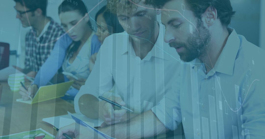 Diverse Team Analyzing Business Data at Office Meeting