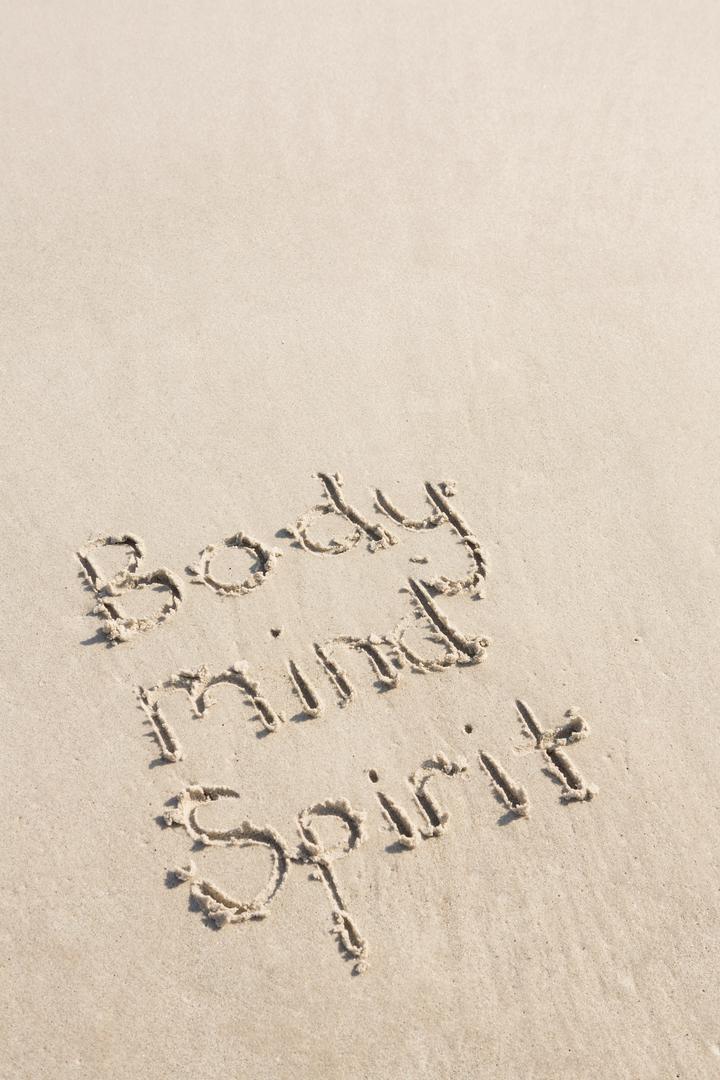 Body mind spirit written on sand - Free Images, Stock Photos and Pictures on Pikwizard.com