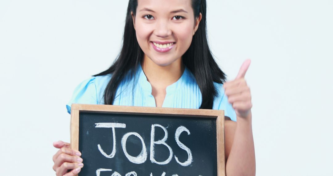 Smiling Businesswoman with Jobs Board Displaying Opportunities - Free Images, Stock Photos and Pictures on Pikwizard.com