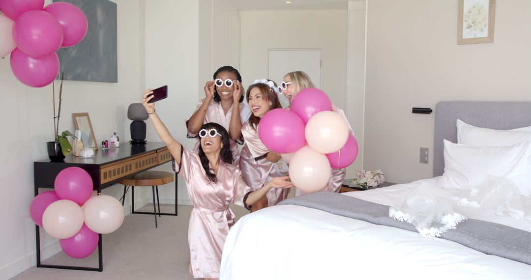 Bridal Party Enjoying Hen Celebration with Selfies and Balloons