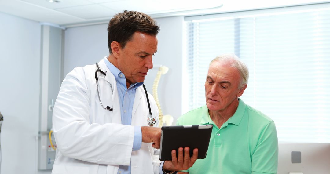 Doctor Consulting Senior Patient in Medical Office Using Digital Tablet - Free Images, Stock Photos and Pictures on Pikwizard.com