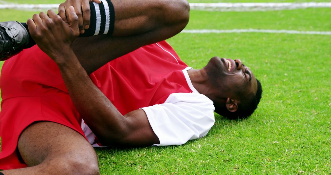 Soccer Player Injured During Match on Field - Free Images, Stock Photos and Pictures on Pikwizard.com