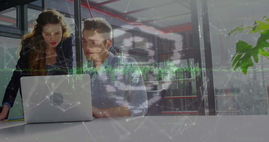 Coworkers Analyzing Data with Tech Elements in Modern Office