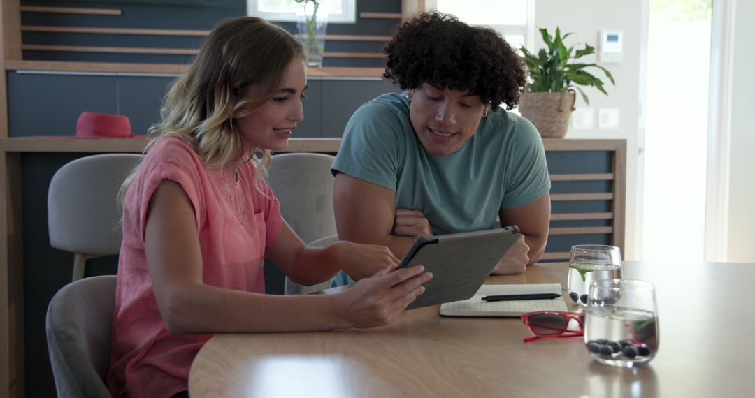 Happy Couple Enjoying Online Shopping Experience with Tablet
