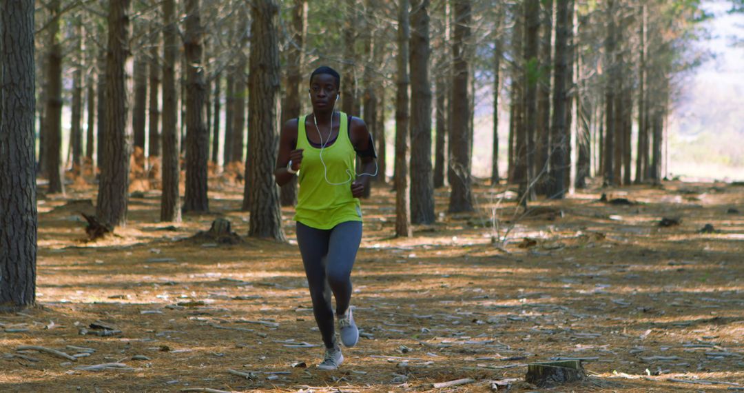 Woman Running in Forest Trail Wearing Athletic Outfit - Free Images, Stock Photos and Pictures on Pikwizard.com