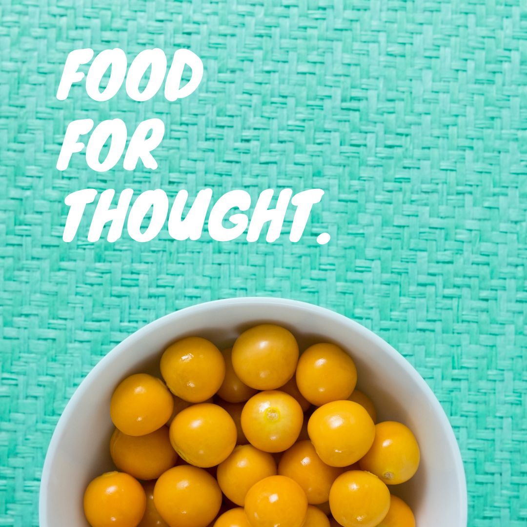 Fresh Yellow Tomatoes on Vibrant Turquoise Background