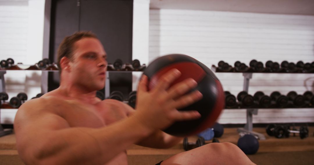 Man Training with Medicine Ball in Gym - Free Images, Stock Photos and Pictures on Pikwizard.com