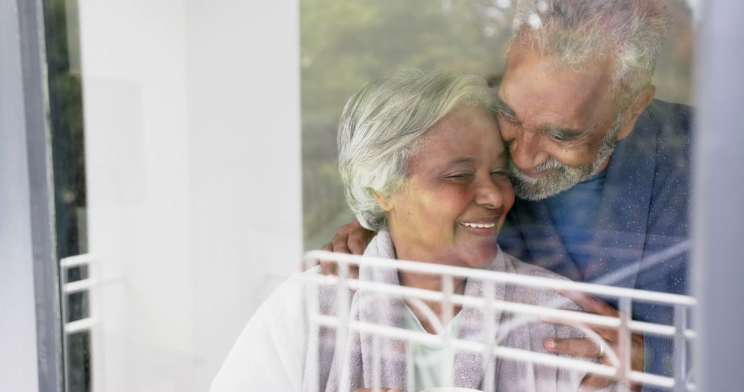 Happy Senior Couple Enjoying Tender Moment at Home - Free Images, Stock Photos and Pictures on Pikwizard.com