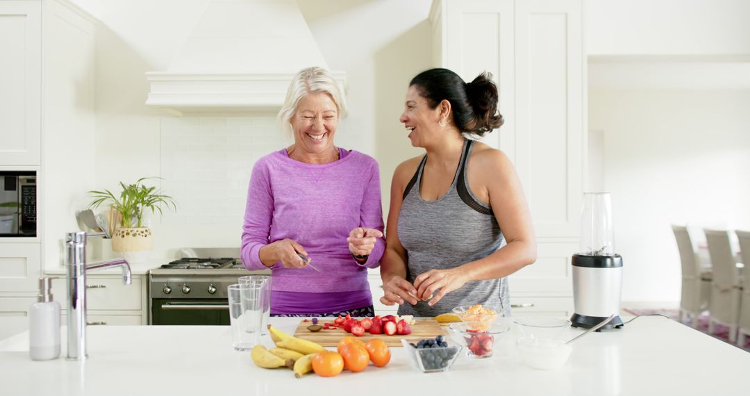 Two Women Preparing Healthy Smoothies in Modern Kitchen - Free Images, Stock Photos and Pictures on Pikwizard.com