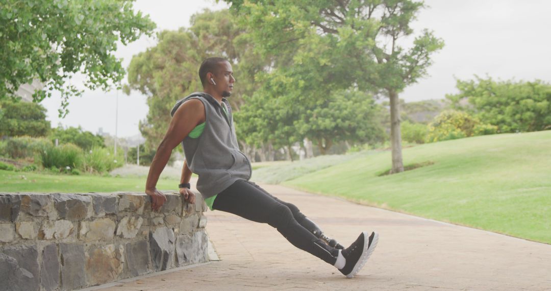 Man Exercising Outdoors with Park Background - Free Images, Stock Photos and Pictures on Pikwizard.com