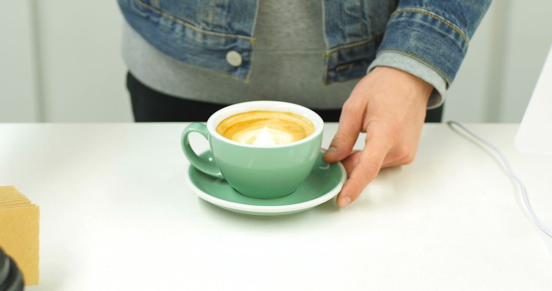 Barista Serving Fresh Cappuccino in Green Cup - Free Images, Stock Photos and Pictures on Pikwizard.com