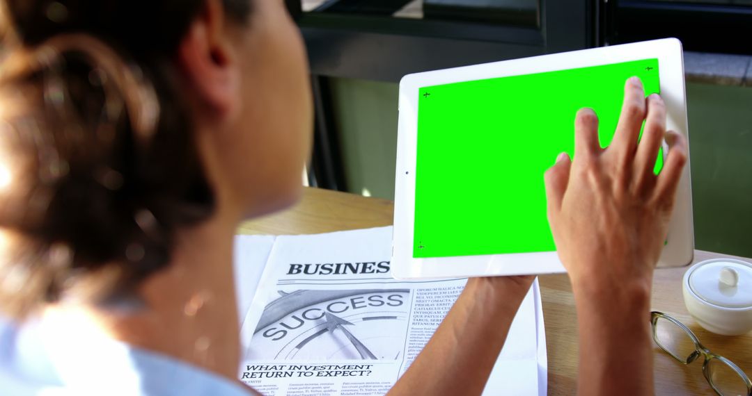 Businesswoman Using Tablet for Remote Work in Cafe