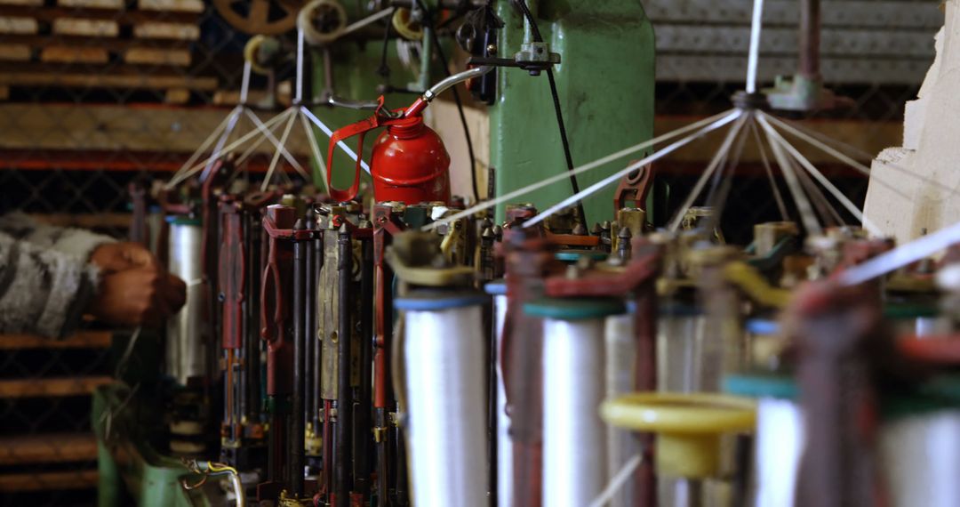 Close Up of Textile Manufacturing Equipment with Spools of Thread - Free Images, Stock Photos and Pictures on Pikwizard.com