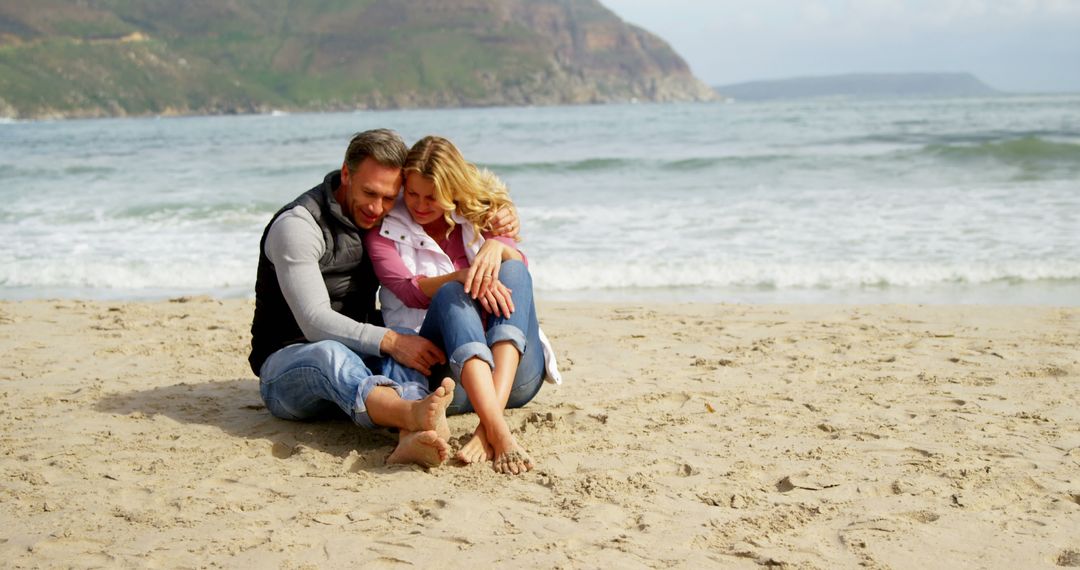 Couple Enjoying Romantic Beach Day with Scenic Mountain Backdrop - Free Images, Stock Photos and Pictures on Pikwizard.com