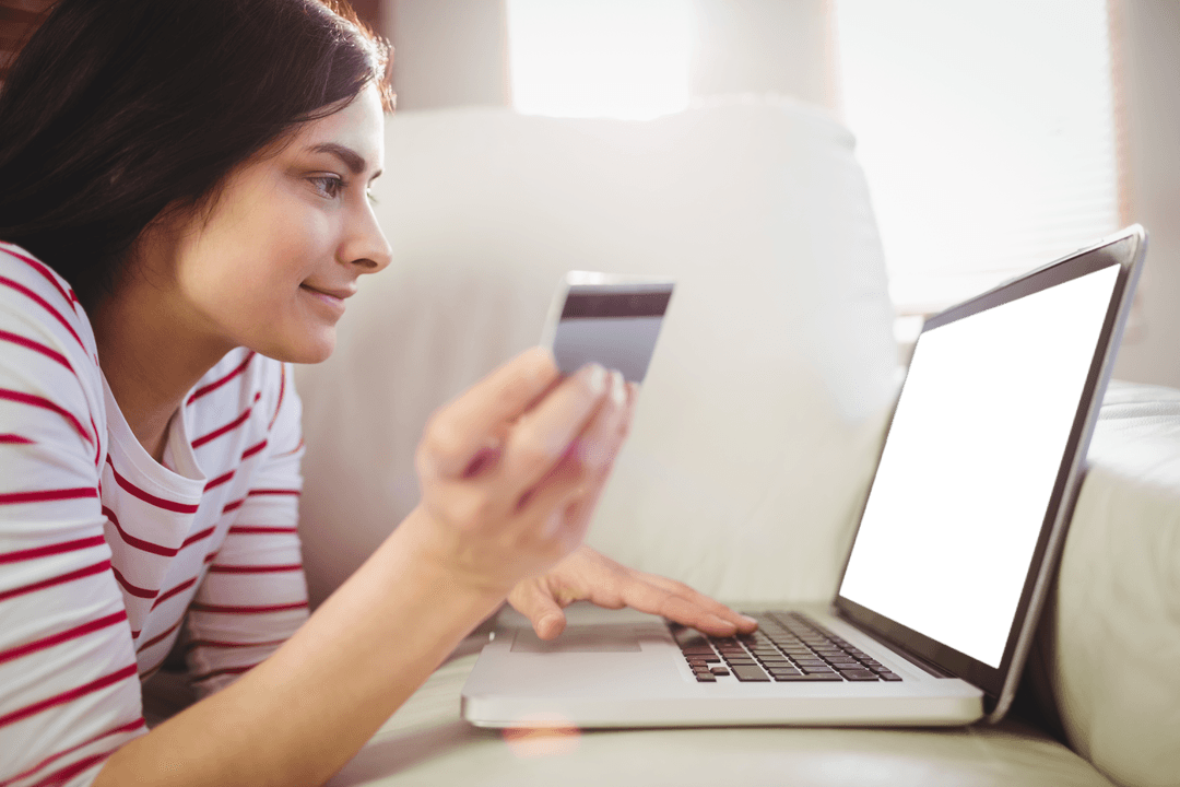 Woman Shopping Online with Credit Card and Laptop Displaying Transparent Background