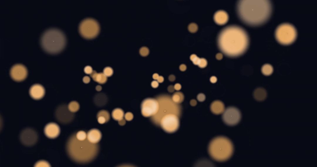 Soft Golden Bokeh Lights on Dark Background
