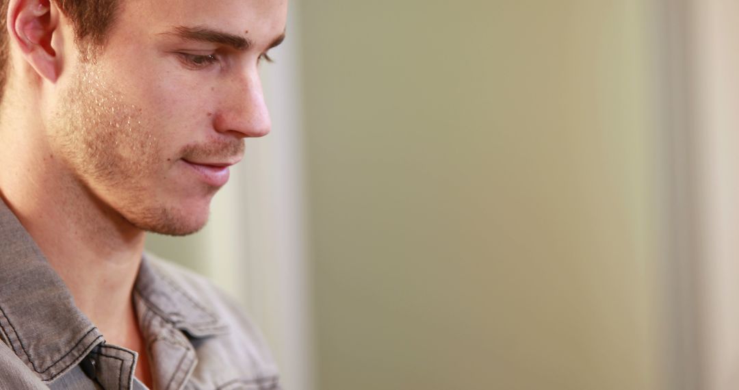 Contemplative Young Man Thinking Deeply With Copy Space